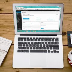mockup of a laptop on a wooden table