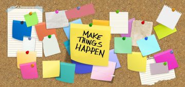 cork bulletin board with a bunch of multi colored post it notes and pins with the motivational quote make things happen pinned in the middle