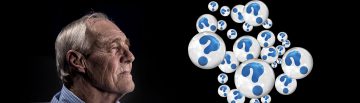 old man staring off into space with question bubbles surrounding him